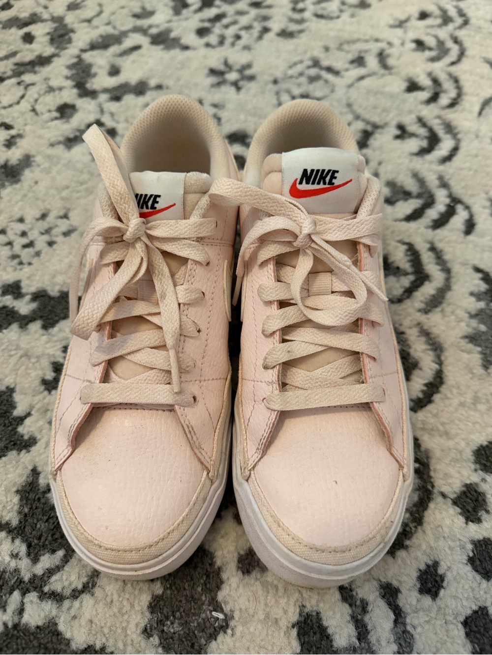 Nike Women’s Pale Pink Low-Top Sneakers with Red Swoosh